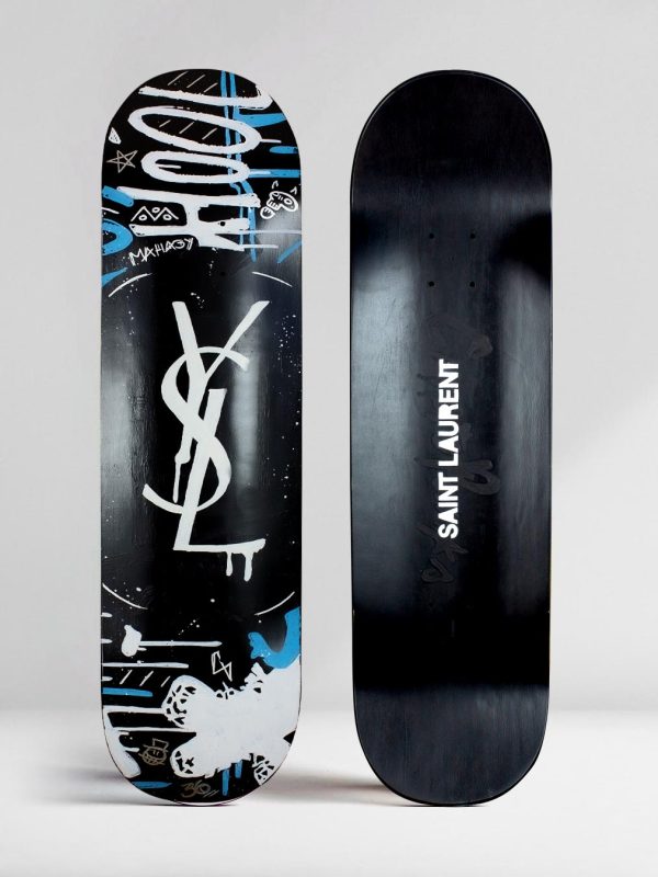 YSL Saint Laurent Graffity Logo on black skateboard deck by Josh Mahaby Artsy