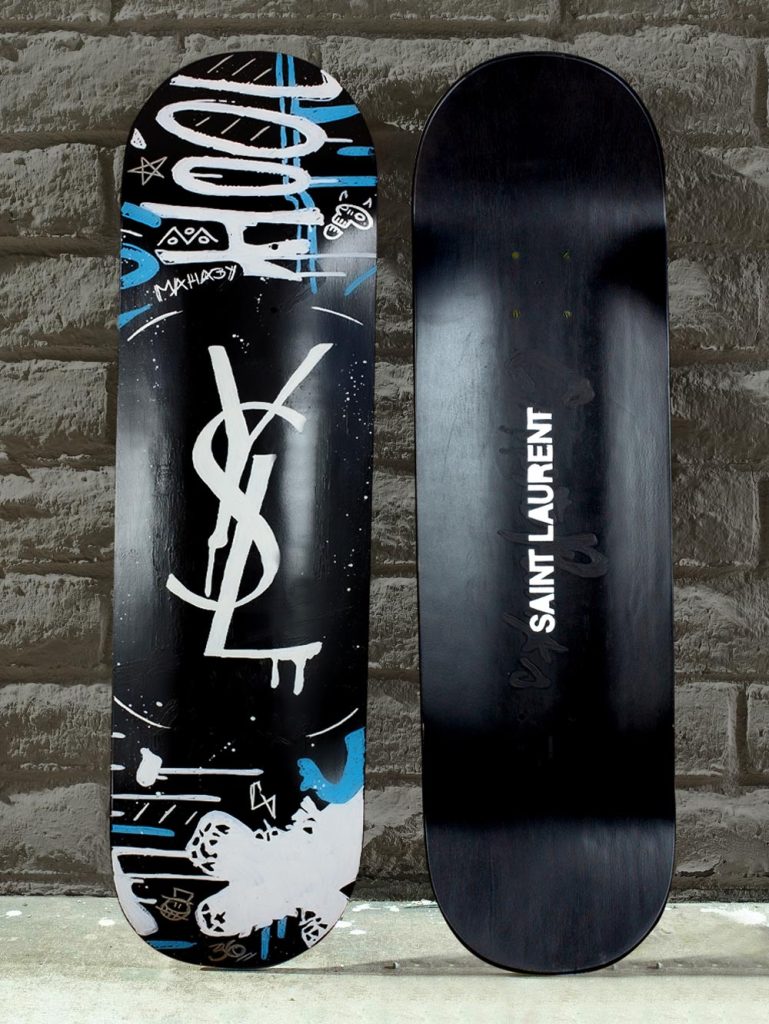 YSL Saint Laurent Graffity Logo on black skateboard deck by Josh Mahaby Artsy